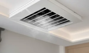 Weak airflow in HVAC shown by a ceiling vent releasing limited air into a living space